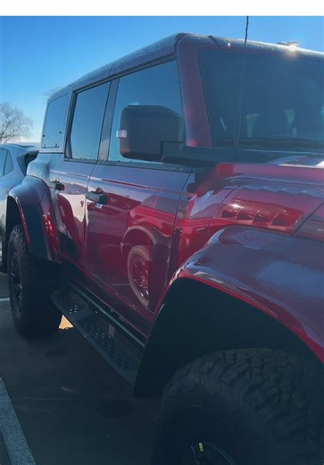 Ruby Red Bronco Raptor… this ain’t an SUV, it’s a warning label 🦖🔥 3.0L EcoBoost • Advanced 4x4 • 10-speed Built to climb curbs, trails… and your neighbor’s ego 😭 Who’s brave enough to take it home? #broncoraptor #fordbronco #raptorlife #offroadnation #@Bronco Life @RGVbroncos @Ford Motor Company @ford.content @Broncos of TikTok
