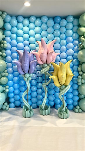 Victoria Dzierza on Instagram: "💐 Pastel Balloon Tulips for Easter & Spring! Giant balloon tulip columns made with @anagramballoons “S” shape curve foil balloons? YES please! These pastel balloon flowers are the cutest touch for your Easter parties, Spring celebrations, or church events! 🌷✨ They make the perfect photo backdrop and scream SPRING vibes! Let this season be a reminder: you are so deeply loved. ✝️ Celebrate big, decorate bigger, and rejoice in the resurrection and the joy of Easter