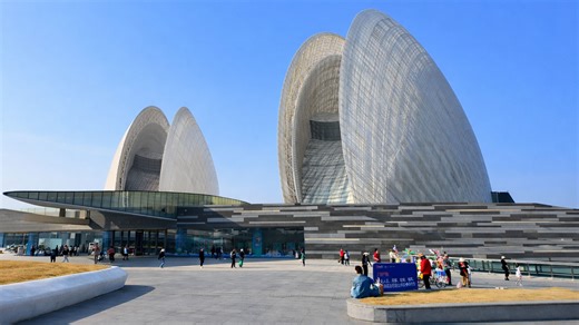 This giant architectural shell hides a massive cultural space inside