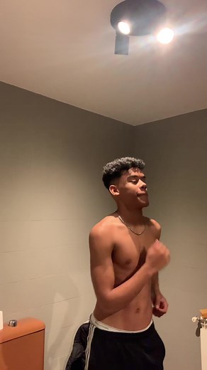 Rhythmic Dance Moves by Shirtless Performer