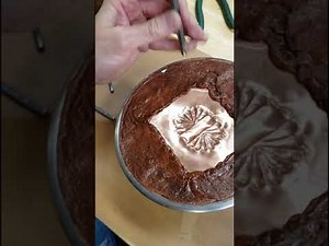 Working in the technique of chasing and repousse'