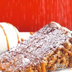 We don’t care how frightful the weather outside gets when we’ve got this NEW Caramel Crunch Cake up in here. Served warm, sweet, and sprinkled with powdered sugar, it’s one thing we definitely don’t mind getting snowed in with. | Ruby Tuesday