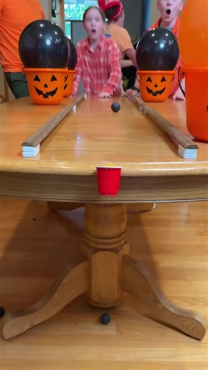 Ping Pong Pumpkin Challenge 🎃 PART 4 The whole family plays a funny Halloween party game where they pour ping pong balls across the table and try to get one in the tiny cup. Whoever gets the orange Jack-O-Lantern ball in, gets a special prize "🎬 This video was produced by Network Media and Benson Bros" | Play Together Stay Together