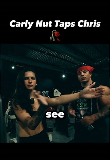 Carly's Playful Nut Tap on Chris: Gym Fun Moments