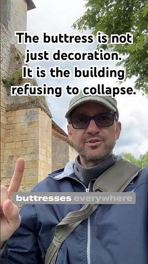 The buttress is not just decoration. It is the building refusing to collapse.