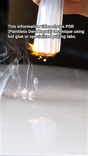 PDR (Paintless Dent Repair) technique using hot glue or specialized pulling tabs.