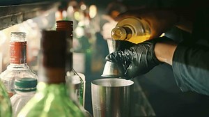 Barman preparing a drink at a bar