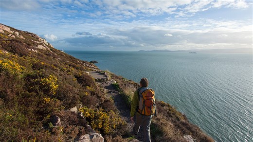 The secret Irish beach with stunning views & tranquil waters by harbour village