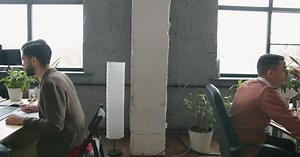 Zoomout of Open Space Office Room and People Employees Working with Computers at Desks