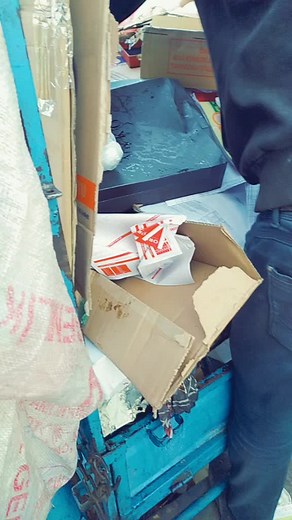 Recycling Process: Sorting Cardboard and Plastic Bags