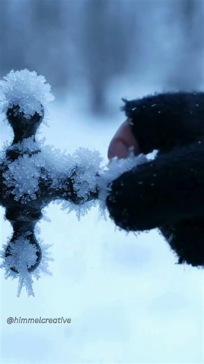 Why do people touch frozen handles before pulling them?