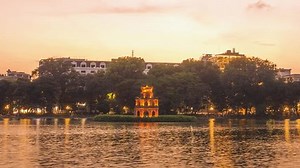 Hoan Kiem Lake ( Ho Guom) or Sword lake in the center of Hanoi in the fog in the morning. It is a famous tourist place in Ha Noi city, Vietnam. Travel and landscape. Timelapse