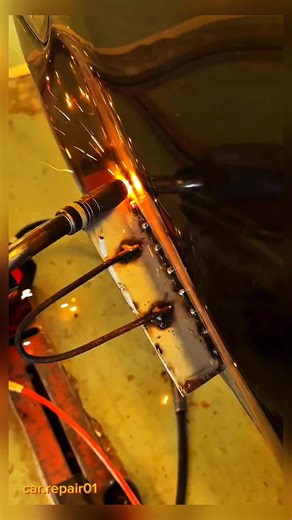 Welding a steel plate to repair dents in the REVO truck bed panel.#factory #installation #bmw #mercedesbenz #creativity