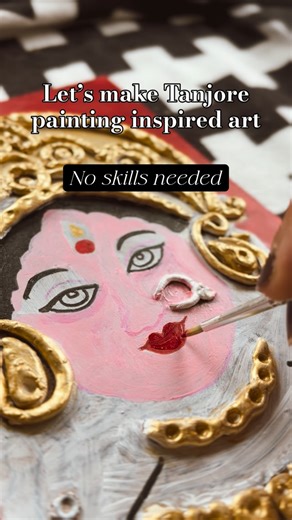 Mikitha & Pinky on Instagram: "Love the look of Tanjore painting but not the price tag? 🏷️ I made this piece using air dry clay and metallic gold paint to achieve the signature look of Tanjore painting with no skills and fraction of the cost. Traditionally, Tanjore paintings are made on wood base with muck paste (Arabic gum & chalk) mixture to create sculpted borders which are gilded with gold foil and semi precious stones. It’s expensive to make and needs a lot of skill. Materials used 