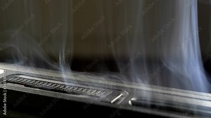 Smoke Rising from Burnt Electronic Computer Device due to Short Circuit