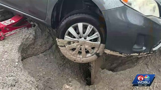 New Orleans driver stuck in massive road hole faces costly repairs
