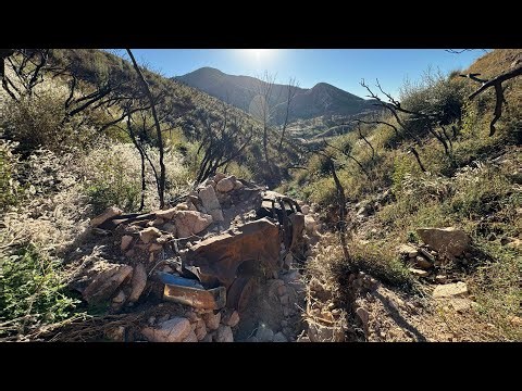 OLD STATION WAGON FOUND AT THE BOTTOM OF A CLIFF.