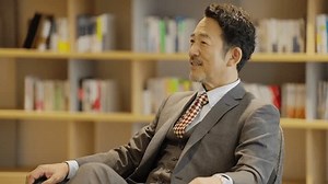Asian company owner being interviewed