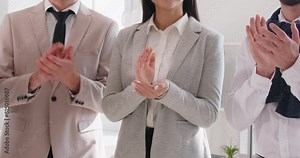 Business professionals in business suits clap hands in applause marking moment of success. Resounding applause echoes their collective pride and recognition of job well done Group of people applause Stock Video