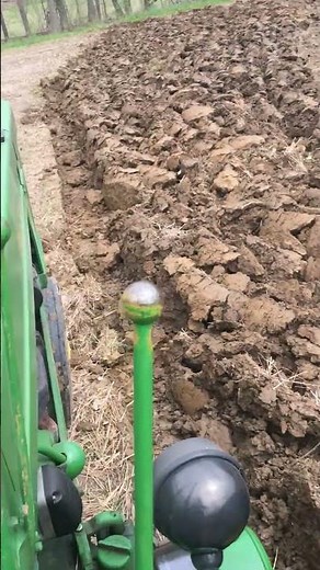 John Deere 50 plowing with trip 2 bottom plow.