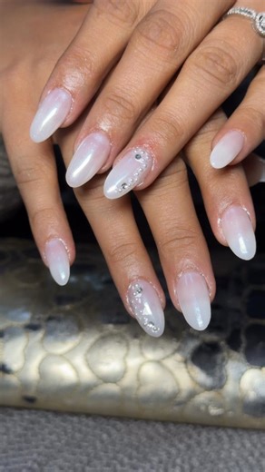 The Vanity Unisex Salon by Sheetal Sharma on Instagram: "Simple but stunning 🤍✨ Milky ombré nail extensions with a touch of sparkle 💎 Tag someone who would love this look 💅 📍 The Vanity – Unisex Salon | Dehradun Hashtags: #NailArtDehradun #DehradunBeauty #TheVanitySalon #NailExtension #OmbreNailDesign"