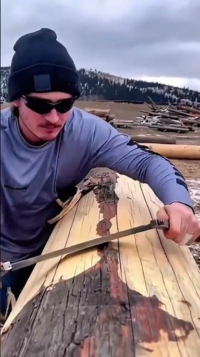 Log Peeling with Traditional Drawknife Technique