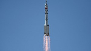 Chinese rocket with 3-person crew docks at new space station