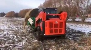 It's a match 🖤 Check out our Hustler bale feeder operating with a Kubota SVL-75 compact loader. | Hustler Equipment