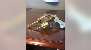 Used for both good and evil, golden gun finally comes home