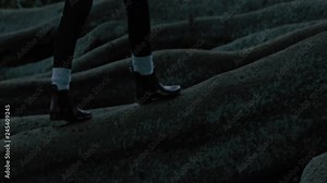 woman legs hiking forest path walking on big tree roots wearing red boots exploring nature enjoying woodland journey