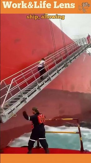 Person transfers from small boat to ship via pilot ladder for efficient crew transfer at sea.