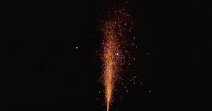 Pyrotechnics sparkling fountain standing on the ground. orange sparkles with audio