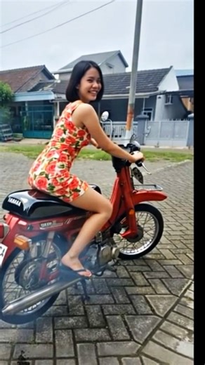 Early morning — the pretty neighbor fires up her moped, and it growls to life.”