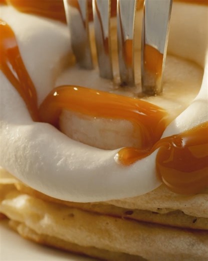 Feast your eyes on the perfect bite 🔍 Salted Caramel Banana Pancakes. | Denny's