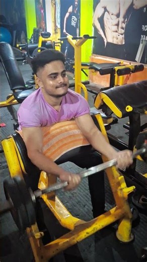 How to Properly Use The Seated Preacher Bicep Curl Machine With Good Form (Exercise Demonstration)