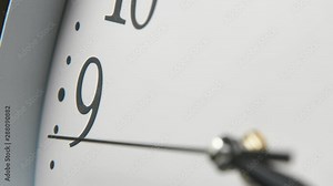 Vintage-looking white clock face and the second hand turning around fast