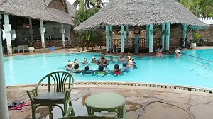 Break from your weekly gym routine and do some pool stretches and workouts😉! A group having a blast doing pool dances and workouts at Neptune Village Beach Resort of Neptune Hotels 🌊. Best believe at our recommend hotels in Diani, you and your friend group, family, as a couple, solo.. you'll all enjoy ☀️😜. ☎️ 0790 499033 or 📨 holidays@phinesafaris.co.ke to book your dream vacay! #TuzuruWapi #neptunehotels #EscapeToParadise #tuzurukenya #feelingthefreedom #phinedeals #neptunevillage #lowseaso