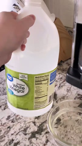 Cleaning a messy microwave after two weeks of use