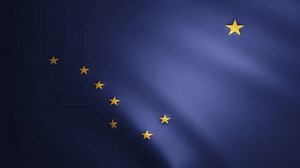 Alaska flag with fabric texture that moves in the wind. Smooth movement of the waving flag in a perfect loop. Blue, yellow, freedom, country, nation, USA state. 4k 60 fps animation.