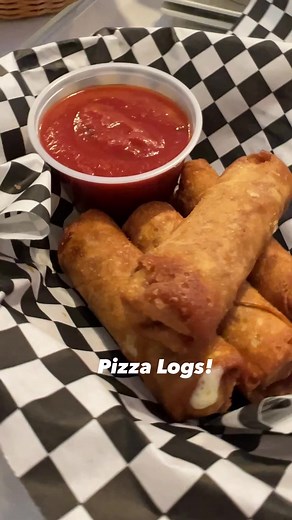 Pizza Logs! I stopped by Alexander's Family Restaurant in Carbondale. Alexander’s doesn’t offer actual pizza, but they do have appetizers called “Pizza Logs!”Pizza logs are like an egg roll, except made with pizza dough, cheese, and pepperoni. They are deep fried and served with a side of Alexander’s delicious marinara sauce.The pizza princess and here world famous laugh made an appearance in this video while I was embarrassingly filming myself eating a pizza log as well as burning the heck out 