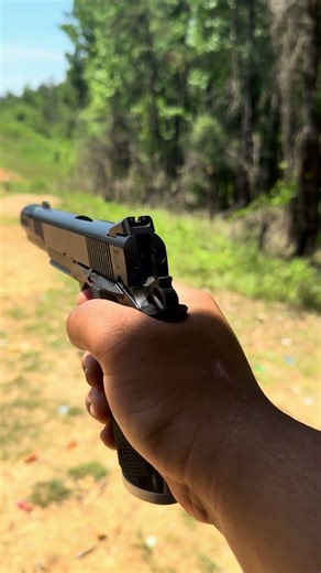 1911 .45 ACP with a muzzle brake — classic power, controlled recoil, clear chamber.