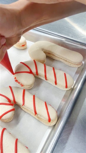 The Ollia elves have started holiday baking with these Candy Cane macarons ❤️懶 filled with peppermint white chocolate ganache! Available in-store & online to order! | $6 or 2 for $10 #byollia #macarons #candycane #baking | Ollia Macarons & Tea | Facebook