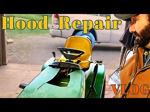 Repairing a John Deere lawnmower hood