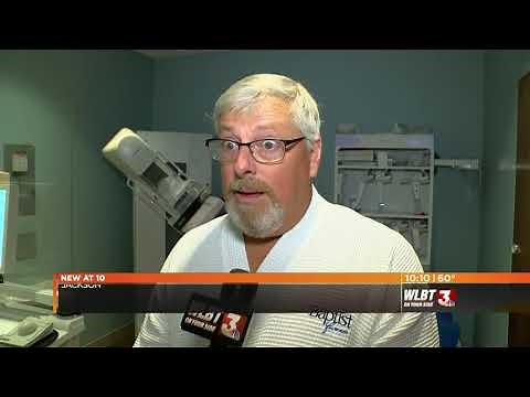 Male Breast Surgeon Demonstrates Getting a Mammogram