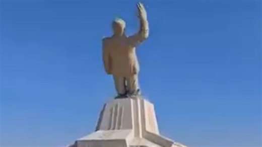 Moment largest Assad statue is toppled as rebels fire AK-47s into the air