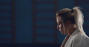 Judo wrestlers are fighting on the tatami. Training fighters. Portrait view.