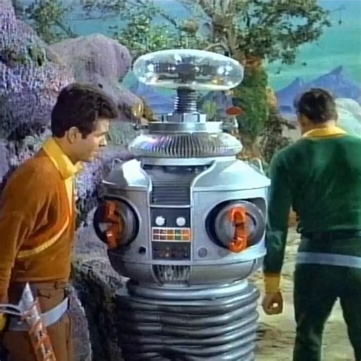 The 1965 TV series Lost in Space, had a cast that included the Robot B-9, and Dr. Zachary Smith. Dr. Smith is famous for hurling creative, alliterative insults at the Robot (often starting with “You…” or “Why you…”).To prepare you early for the anti-anti-Clanker movement it is proper to have some colorful metaphors handy. Here is the complete documented list of every name-calling insult Dr. Smith directs at the Robot across the series:•Addlepated Amateur•Addlepated Armor Bearer•Aluminum Canary•A