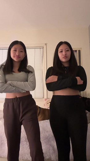 Cute Asian Sisters Dancing Duo