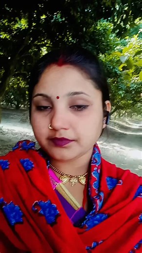 jyotikumarivid on Instagram: "Face unchanged from uploaded image, create a young man and a young woman are posing together. They are coordinating their outfits with a pink color theme. Man's Attire: He is wearing a bright, solid pink, long-sleeved dress shirt with the top button undone. The sleeves are rolled down. He pairs this with white or off-white trousers/jeans. Woman's Attire: She is wearing a traditional pink saree adorned with silver or light pink sequins/embellishments scattered across