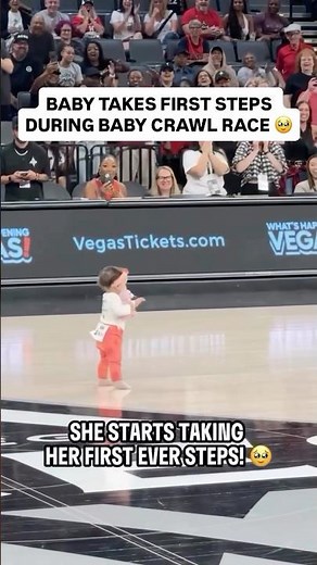 Baby takes first steps during baby crawl race